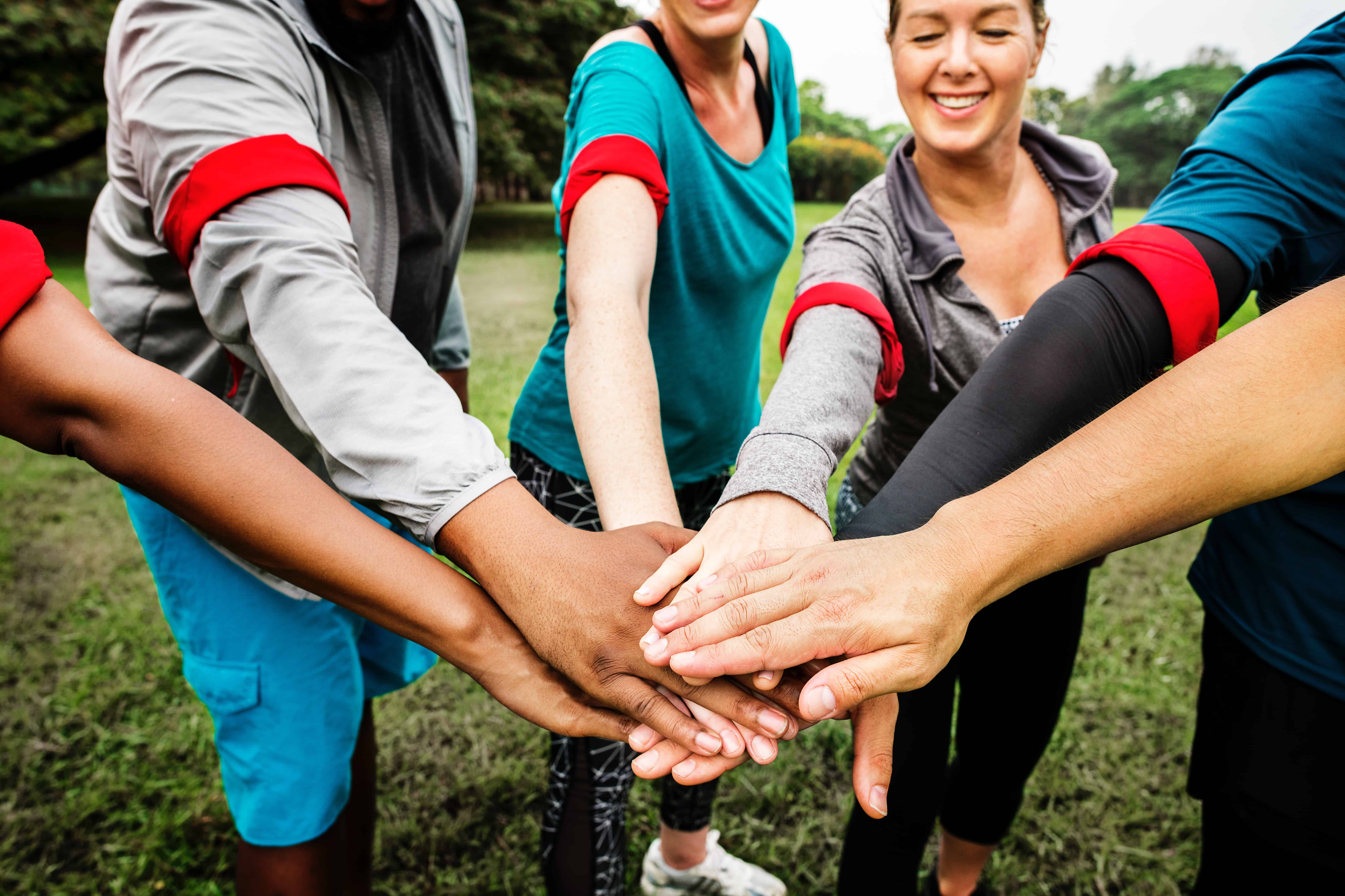 a group of people showing their unity